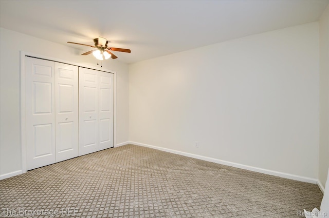 810 Plate St Unit 103, Rochester, MI 48307 - unfurnished bedroom with carpet flooring, baseboards, a closet, and a ceiling fan
