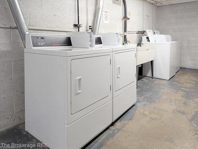 810 Plate St Unit 103, Rochester, MI 48307 - shared laundry room featuring washer and dryer