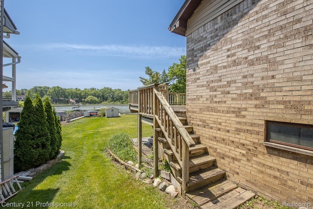 4851 Shoreline Blvd, Waterford, MI 48329 - view of green lawn featuring a wooden deck and stairway