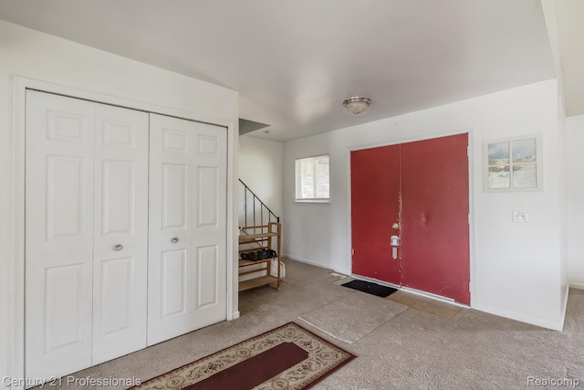 4851 Shoreline Blvd, Waterford, MI 48329 - foyer with stairway, carpet floors, and baseboards