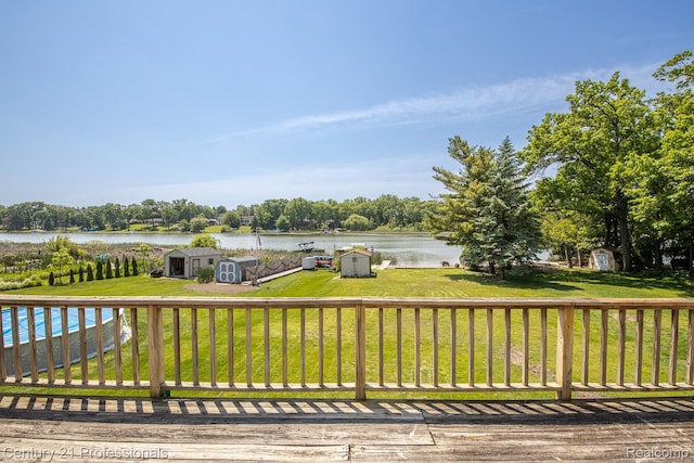 4851 Shoreline Blvd, Waterford, MI 48329 - wooden deck with a water view, a lawn, and view of wooded area