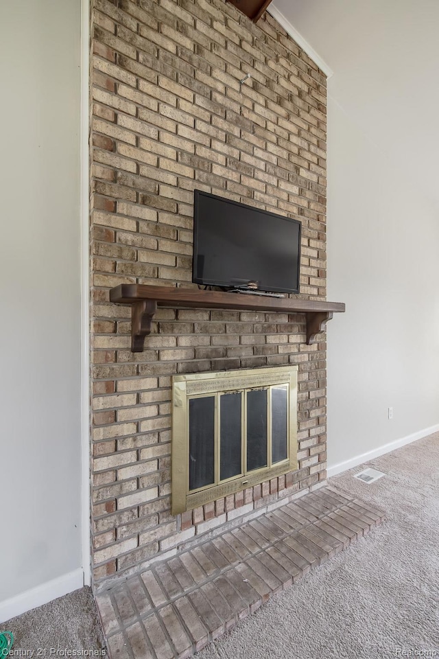 4851 Shoreline Blvd, Waterford, MI 48329 - detailed view of carpet, a brick fireplace, and baseboards