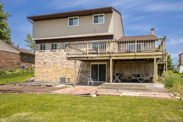 4851 Shoreline Blvd, Waterford, MI 48329 - rear view of house featuring brick siding, a deck, a yard, a patio, and central AC