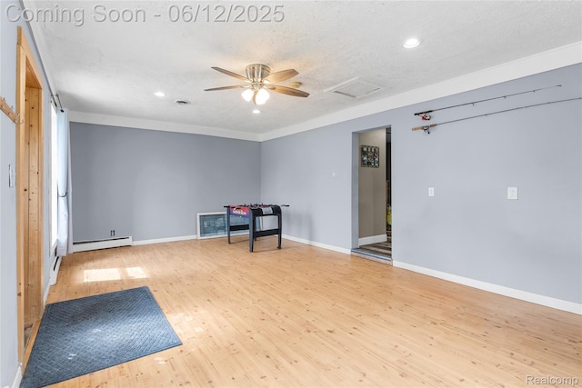 335 Main St, Morrice, MI 48857 - unfurnished room with a baseboard heating unit, wood finished floors, attic access, recessed lighting, and baseboards