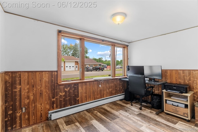 335 Main St, Morrice, MI 48857 - office with a baseboard heating unit, a wainscoted wall, wooden walls, and wood finished floors