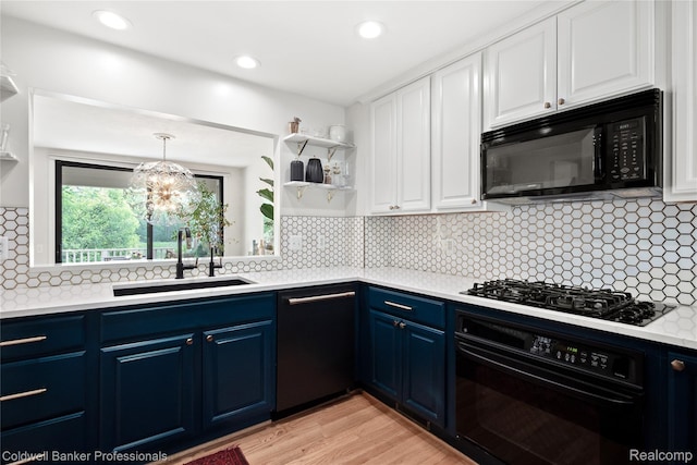 916 Tartan Trl, Bloomfield Hills, MI 48304 - kitchen featuring black appliances, blue cabinetry, a sink, white cabinets, and recessed lighting