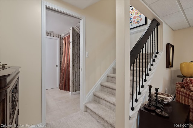 916 Tartan Trl, Bloomfield Hills, MI 48304 - stairs with a paneled ceiling, tile patterned floors, and baseboards