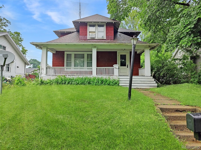 1505 Downey St, Flint, MI 48503 - bungalow-style home with roof with shingles, a porch, and a front yard