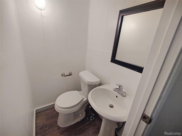 1505 Downey St, Flint, MI 48503 - half bath with wood finished floors, toilet, and a sink