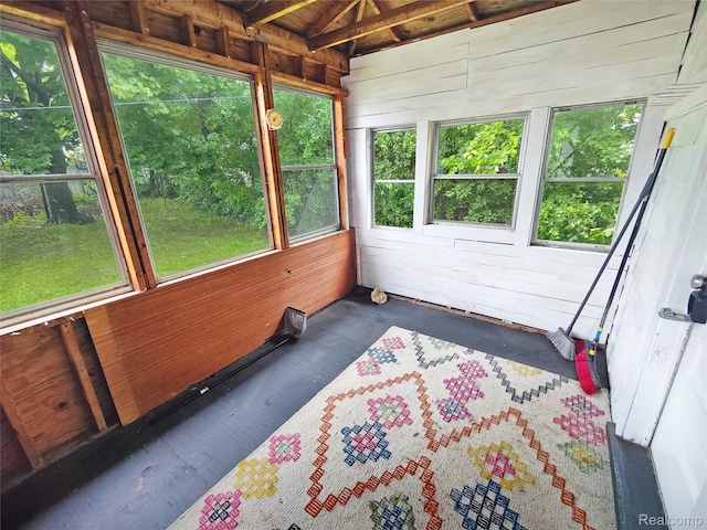 1505 Downey St, Flint, MI 48503 - unfurnished sunroom featuring wood walls and wood finished floors