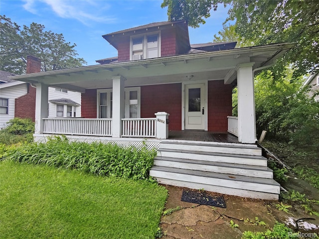1505 Downey St, Flint, MI 48503 - view of front of home featuring covered porch