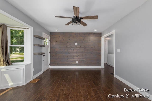 4246 Flamingo Ave SW, Wyoming, MI 49509 - unfurnished room with ceiling fan, baseboards, wood finished floors, recessed lighting, and wooden walls