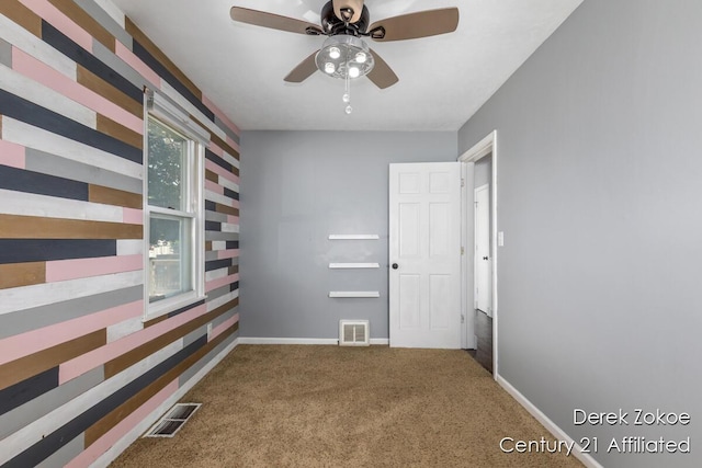4246 Flamingo Ave SW, Wyoming, MI 49509 - carpeted spare room featuring ceiling fan and baseboards