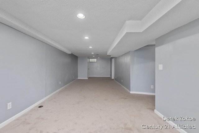 4246 Flamingo Ave SW, Wyoming, MI 49509 - finished below grade area with recessed lighting, carpet, baseboards, and a textured ceiling