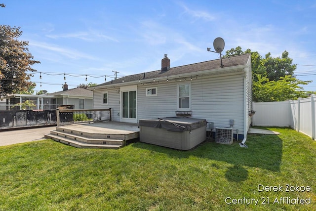 4246 Flamingo Ave SW, Wyoming, MI 49509 - rear view of house with a wooden deck and a chimney