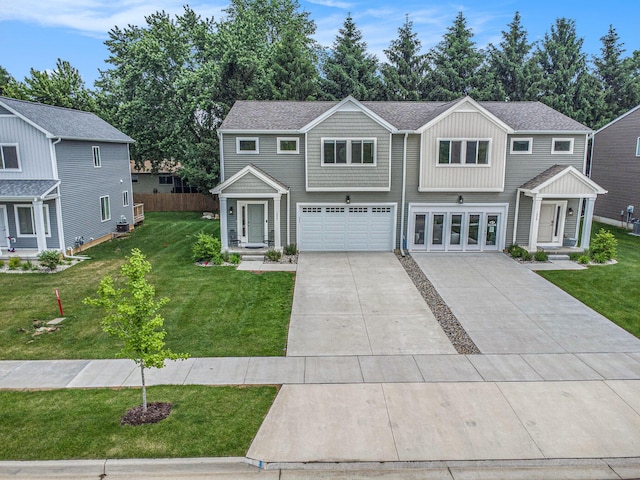 1047 Rebecca St, Marshall, MI 49068 - view of front of home with an attached garage, concrete driveway, and a front yard