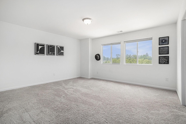 1047 Rebecca St, Marshall, MI 49068 - carpeted empty room featuring baseboards