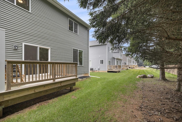 1047 Rebecca St, Marshall, MI 49068 - view of green lawn with a deck