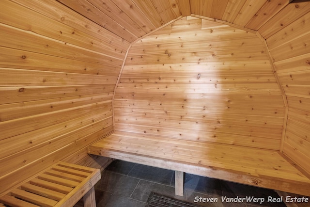 5185 W Nurnberg Rd, Michigan, MI 49411 - relaxing sauna with wood ceiling, tile patterned flooring, and wooden walls