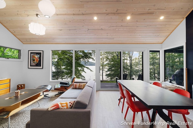 5185 W Nurnberg Rd, Michigan, MI 49411 - dining area featuring wood ceiling, vaulted ceiling, healthy amount of natural light, and light wood finished floors