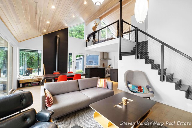 5185 W Nurnberg Rd, Michigan, MI 49411 - living room with wood ceiling, wood-type flooring, recessed lighting, stairway, and high vaulted ceiling