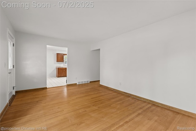 1616 Catalpa Dr, Royal Oak, MI 48067 - unfurnished room with light wood-type flooring and baseboards