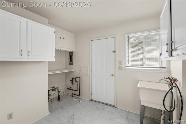 9243 Cornell St, Plymouth, MI 48180 - washroom with cabinet space and light marble finish flooring