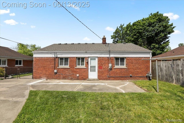 9243 Cornell St, Plymouth, MI 48180 - rear view of house featuring brick siding and a chimney