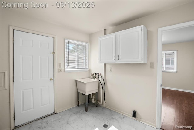 9243 Cornell St, Plymouth, MI 48180 - laundry area with cabinet space, washer hookup, and light marble finish floors