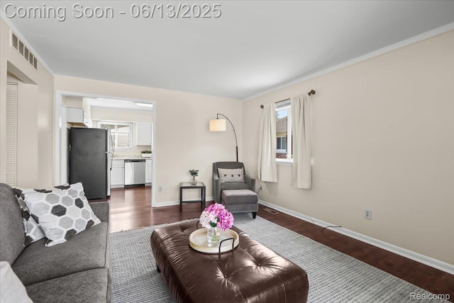 9243 Cornell St, Plymouth, MI 48180 - living area with dark wood-style floors and plenty of natural light