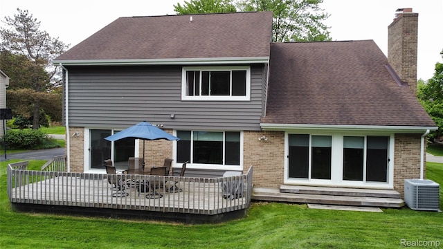 5084 Champlain Cir W, Bloomfield, MI 48323 - back of house featuring brick siding, a chimney, central AC, a lawn, and a shingled roof