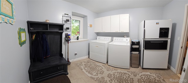 5084 Champlain Cir W, Bloomfield, MI 48323 - laundry area featuring washer and dryer, cabinet space, and baseboards