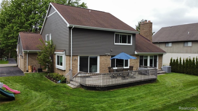 5084 Champlain Cir W, Bloomfield, MI 48323 - rear view of property featuring brick siding, a chimney, a lawn, and a shingled roof