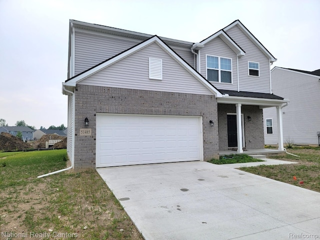 51485 Maple Leaf Dr, Macomb, MI 48042 - traditional-style home with brick siding, concrete driveway, and covered porch