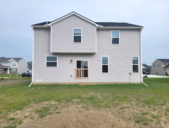 51485 Maple Leaf Dr, Macomb, MI 48042 - rear view of house with a lawn