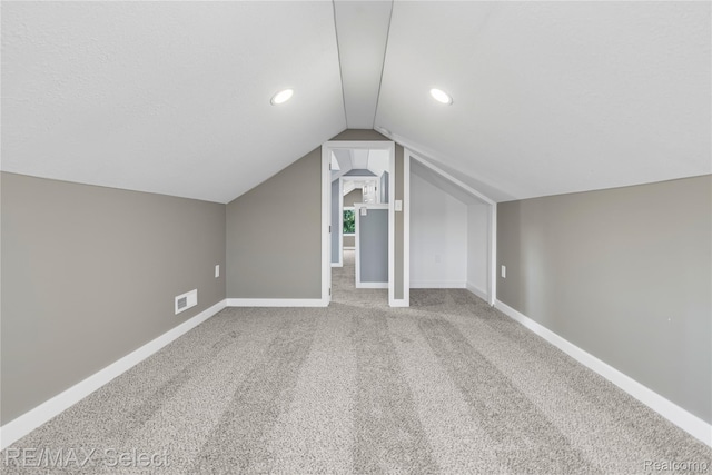 4470 N Lake Rd, Columbiaville, MI 48421 - bonus room featuring vaulted ceiling, carpet flooring, and recessed lighting