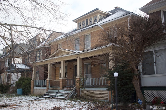 3309 Lothrop St, Detroit, MI 48206 - american foursquare style home featuring brick siding and covered porch