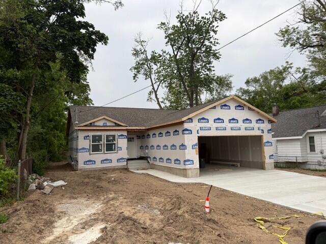 561 Mary St, Muskegon, MI 49442 - property under construction with an attached garage and driveway