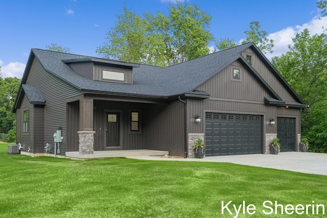 8060 Hunters Xing, Kalamazoo, MI 49009 - view of front of house with central AC, a garage, a front yard, driveway, and stone siding