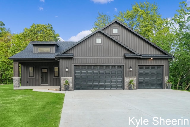 8060 Hunters Xing, Kalamazoo, MI 49009 - view of front facade with driveway, an attached garage, stone siding, a front yard, and a shingled roof
