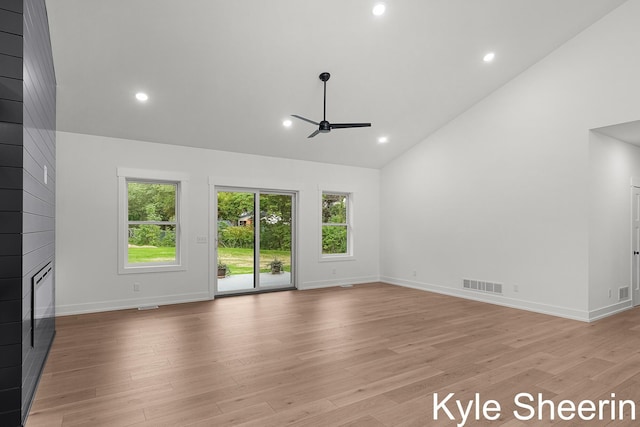 8060 Hunters Xing, Kalamazoo, MI 49009 - unfurnished living room featuring high vaulted ceiling, a ceiling fan, a fireplace, light wood-style floors, and baseboards