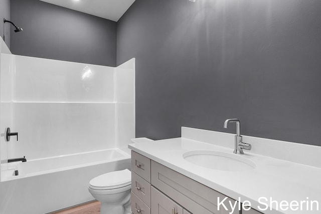 8060 Hunters Xing, Kalamazoo, MI 49009 - bathroom featuring vanity, toilet, bathing tub / shower combination, and wood finished floors