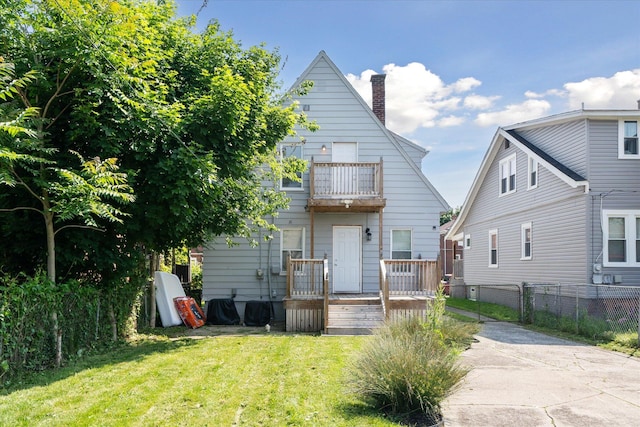 289 Newport St, Detroit, MI 48215 - back of house with a balcony and a chimney