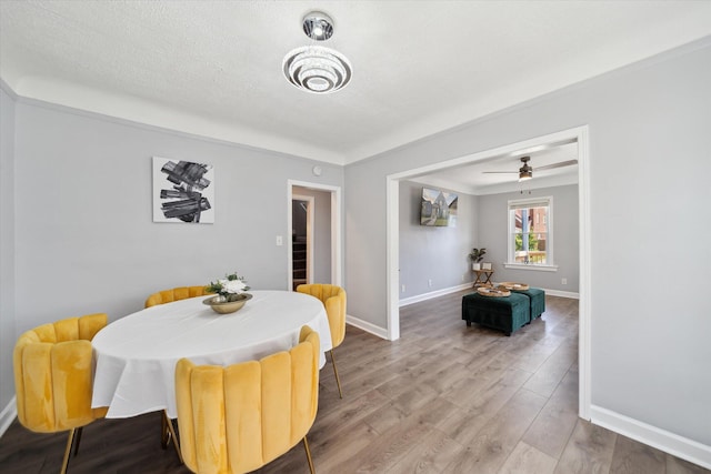 289 Newport St, Detroit, MI 48215 - dining room featuring baseboards, wood finished floors, and ceiling fan