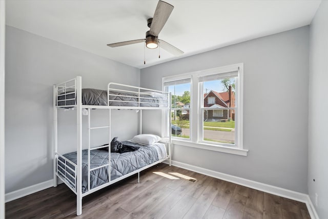 289 Newport St, Detroit, MI 48215 - bedroom featuring baseboards, wood finished floors, and a ceiling fan