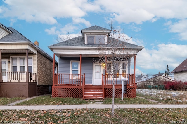 11620 Nagel St, Hamtramck, MI 48212 - view of front facade with covered porch and a shingled roof