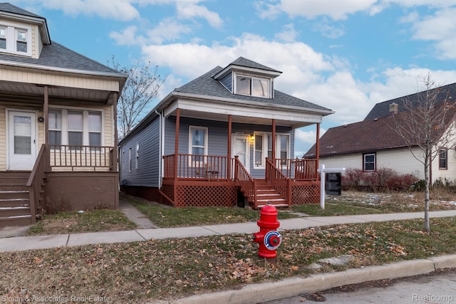 11620 Nagel St, Hamtramck, MI 48212 - view of front of home featuring covered porch, roof with shingles, and stairs