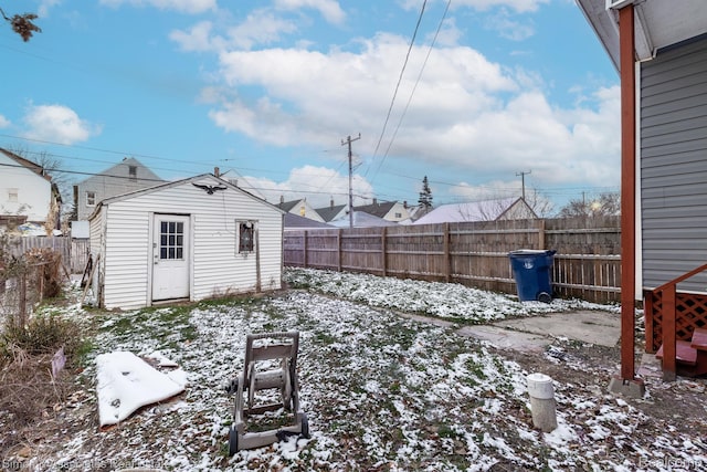 11620 Nagel St, Hamtramck, MI 48212 - yard layered in snow featuring a fenced backyard and an outbuilding