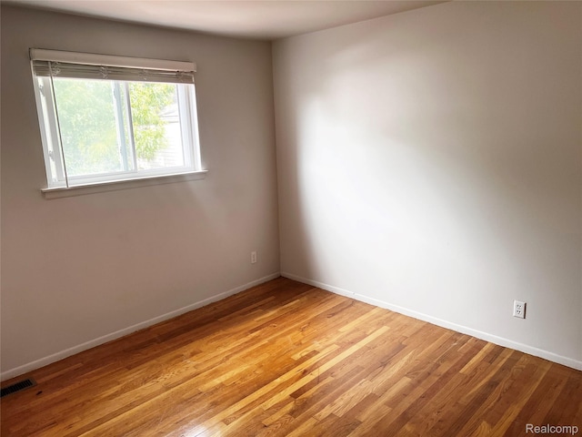 25731 Salem Ct Unit 63, Roseville, MI 48066 - empty room featuring baseboards and light wood-type flooring