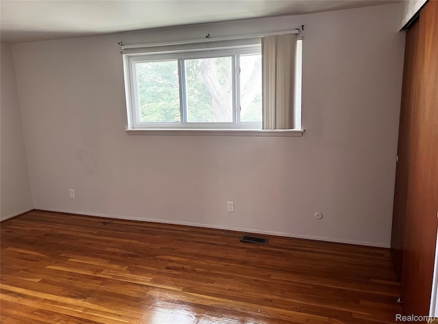 25731 Salem Ct Unit 63, Roseville, MI 48066 - empty room with wood finished floors and baseboards